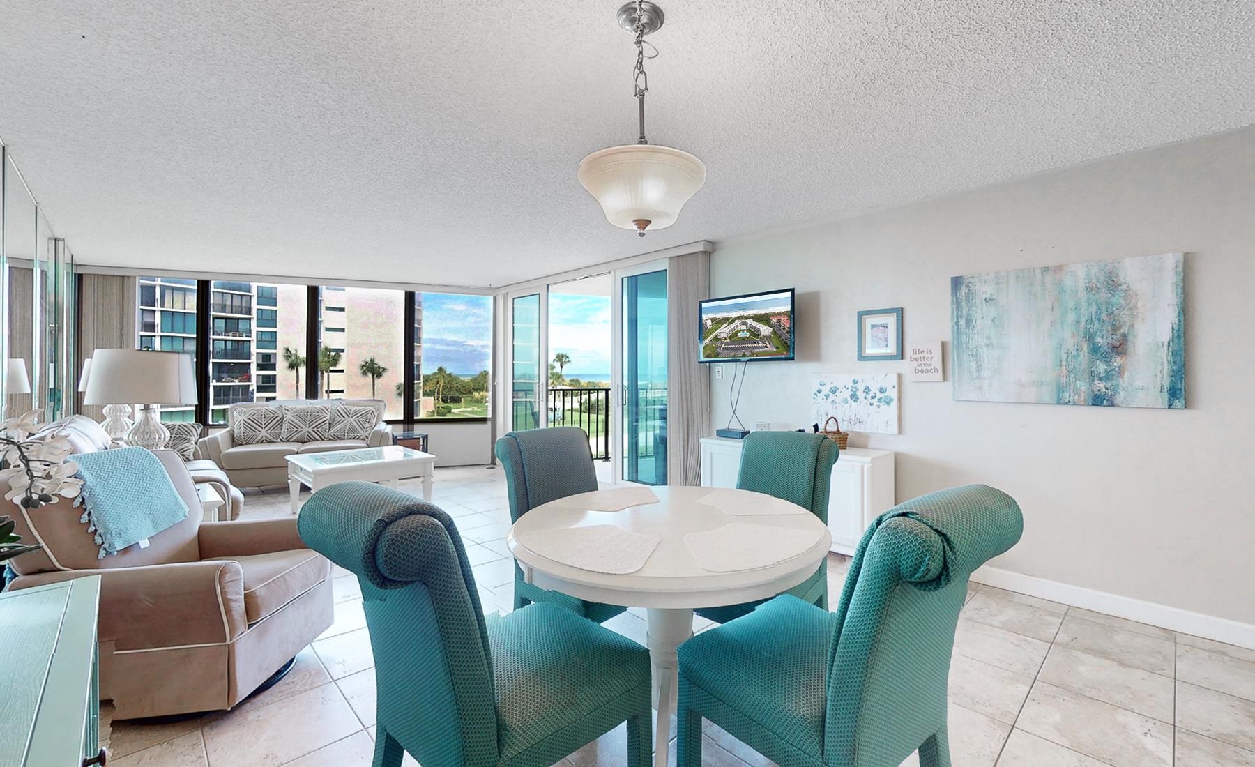 1 Dondanville Road, Unit C 215 St. Augustine, FL 32080 - Photo 6 of 33 a view of a dining room with furniture window and wooden floor