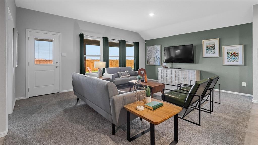 1609 Tin Roof Road Krum, TX 76249 - Photo 10 of 39 a living room with furniture and a flat screen tv