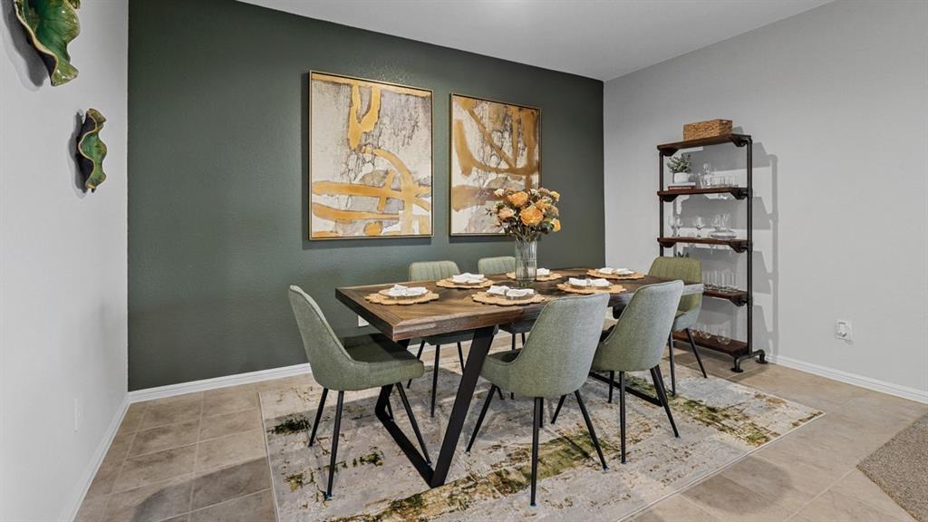 1609 Tin Roof Road Krum, TX 76249 - Photo 12 of 39 a view of a dining room with furniture and window