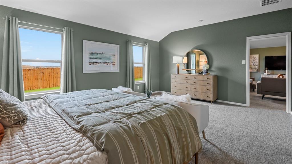 1609 Tin Roof Road Krum, TX 76249 - Photo 19 of 39 a bedroom with a bed and a dresser