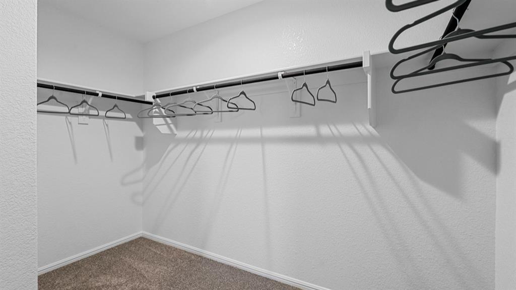 1609 Tin Roof Road Krum, TX 76249 - Photo 24 of 39 a view of a room with racks on the wall