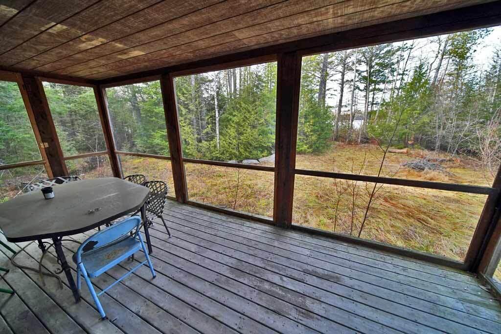 60-68 Lower Lake Road Danforth, ME 04424 - Photo 21 of 72 screened-porch-log-cabin