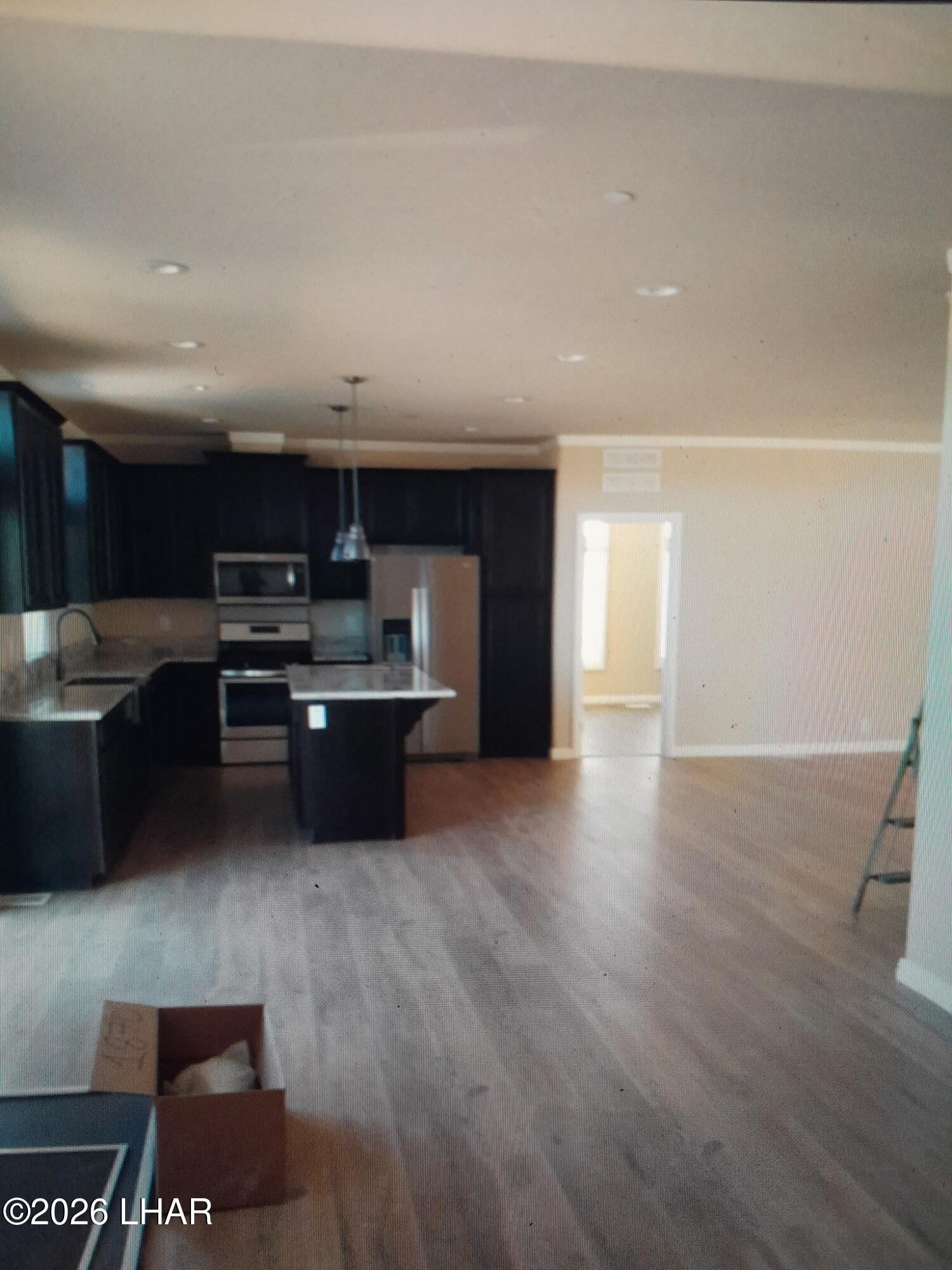 42159 Harms Way Salome, AZ 85348 - Photo 16 of 16 a kitchen with stainless steel appliances a sink a stove a microwave a counter top and cabinets