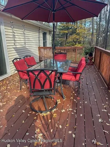 a view of a backyard with sitting area