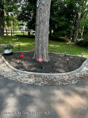 a kitchen with granite countertop a sink a stove and cabinets