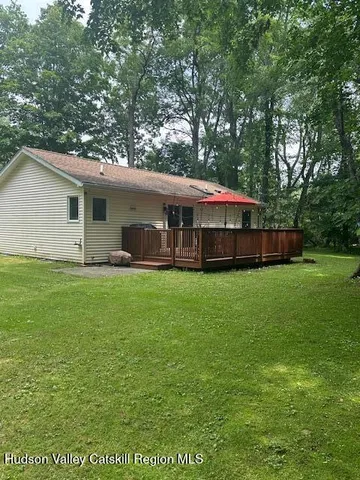 a kitchen with stainless steel appliances a stove a microwave a sink and cabinets