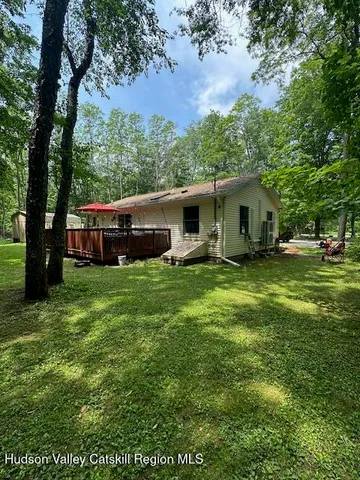 a view of a dining room with furniture wooden floor and chandelier