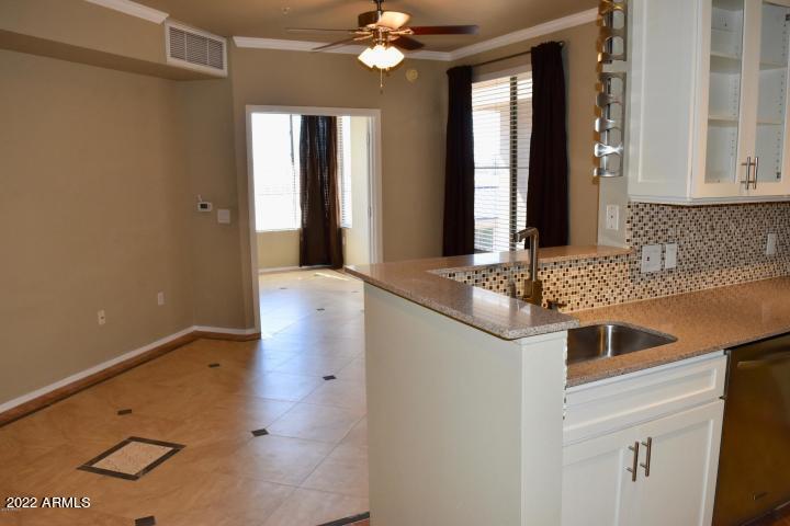 1701 East Colter Street, Unit 459 Phoenix, AZ 85016 - Photo 1 of 50 a kitchen with a sink and a mirror