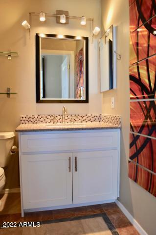 1701 East Colter Street, Unit 459 Phoenix, AZ 85016 - Photo 13 of 50 a bathroom with a sink a mirror and a shower