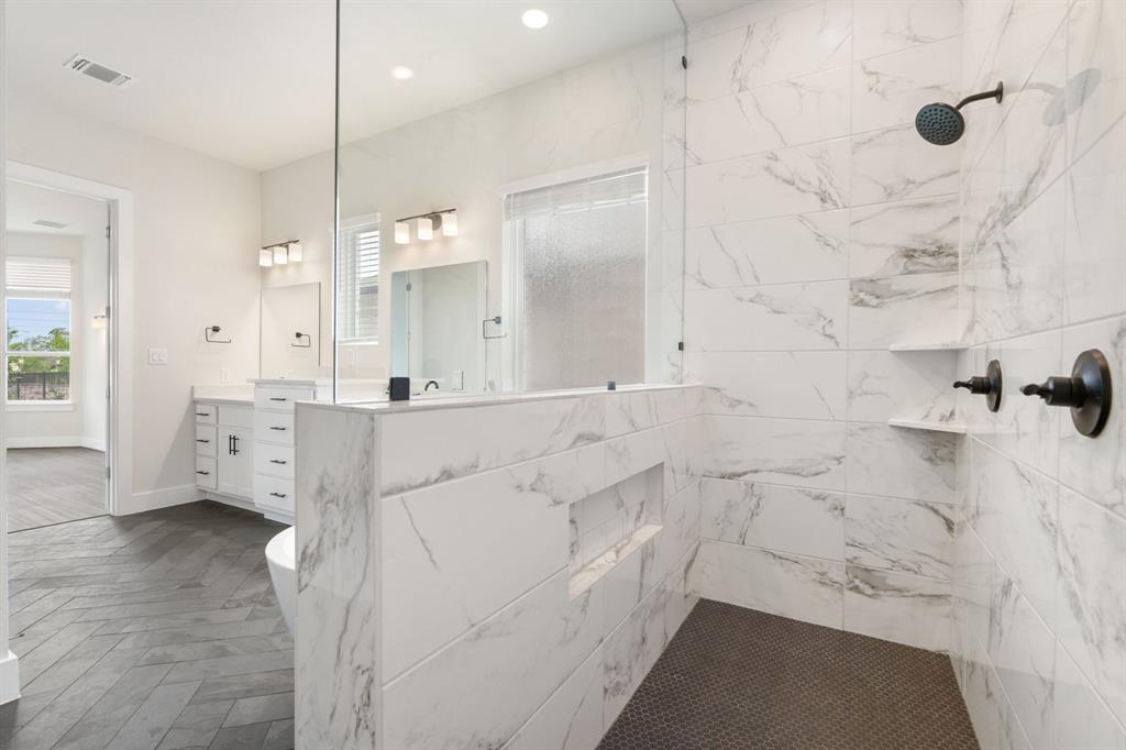 504 Tomichi Trail Austin, TX 78738 - Photo 26 of 36 a bathroom with shower sink and mirror