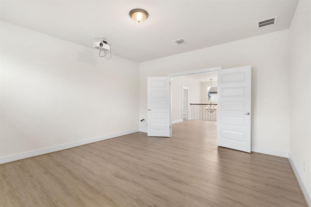 504 Tomichi Trail Austin, TX 78738 - Photo 28 of 36 a view of empty room with wooden floor
