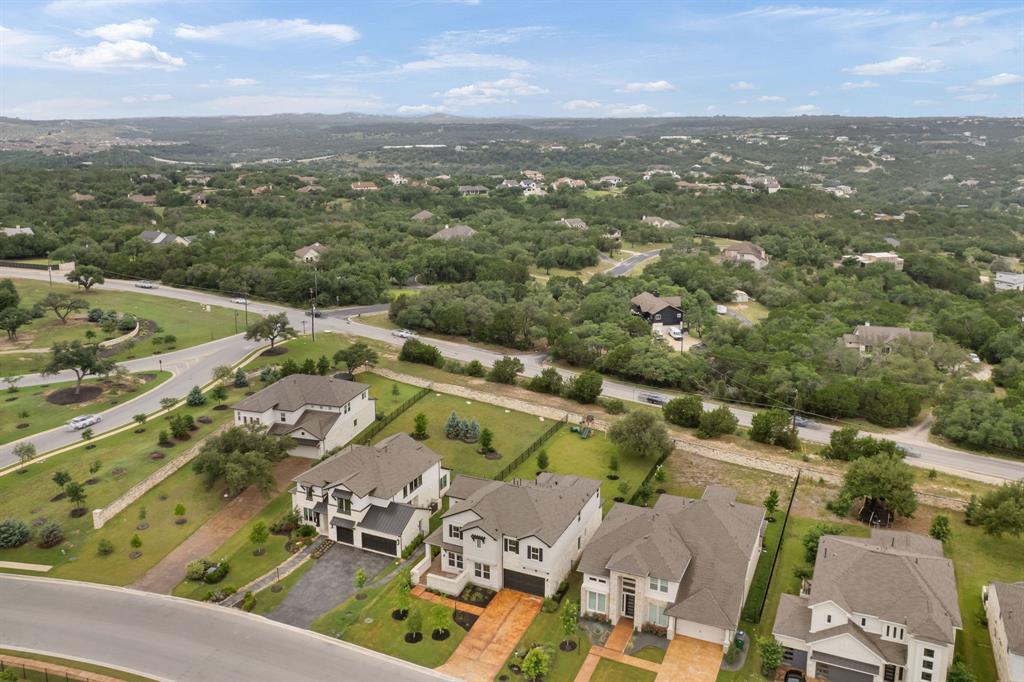 504 Tomichi Trail Austin, TX 78738 - Photo 3 of 36 an aerial view of residential houses with outdoor space