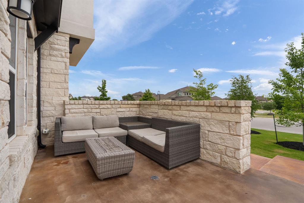 504 Tomichi Trail Austin, TX 78738 - Photo 5 of 36 a view of a terrace with couches and a table