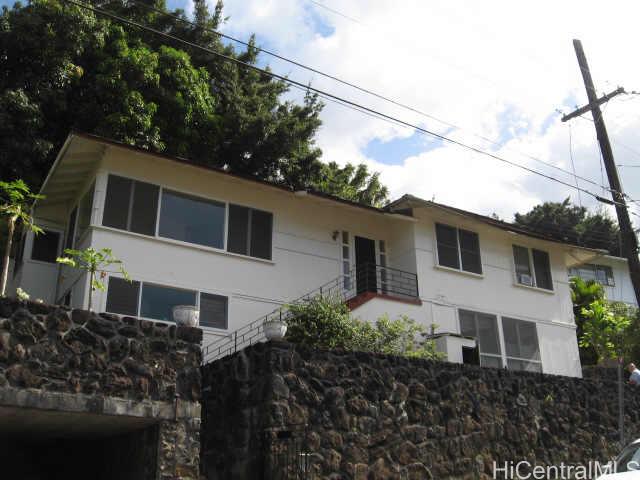 2454 Booth Road Honolulu, HI 96813 - Photo 1 of 1 a house that has a tree in front of it