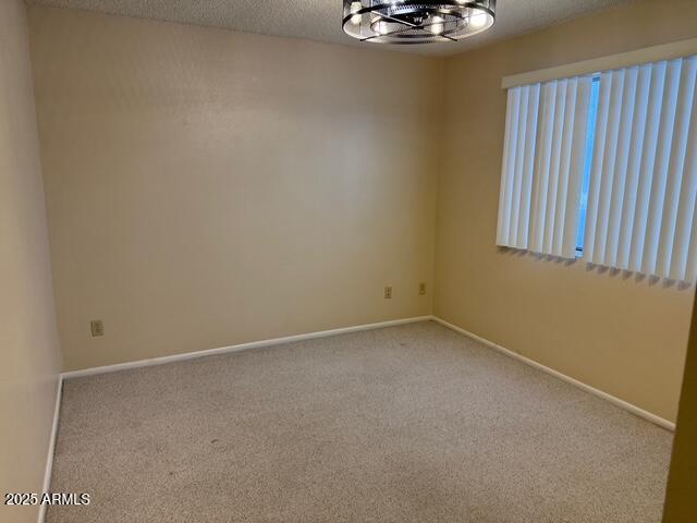 1105 West Juanita Avenue Mesa, AZ 85210 - Photo 17 of 25 an empty room with a window