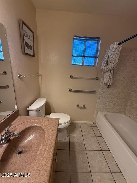 1105 West Juanita Avenue Mesa, AZ 85210 - Photo 18 of 25 a bathroom with a sink a toilet and mirror