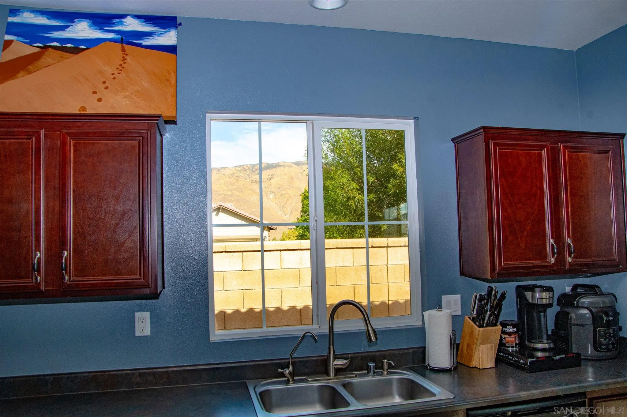 2131 Canvas Way San Jacinto, CA 92582 - Photo 13 of 36 a kitchen with a sink cabinets and window
