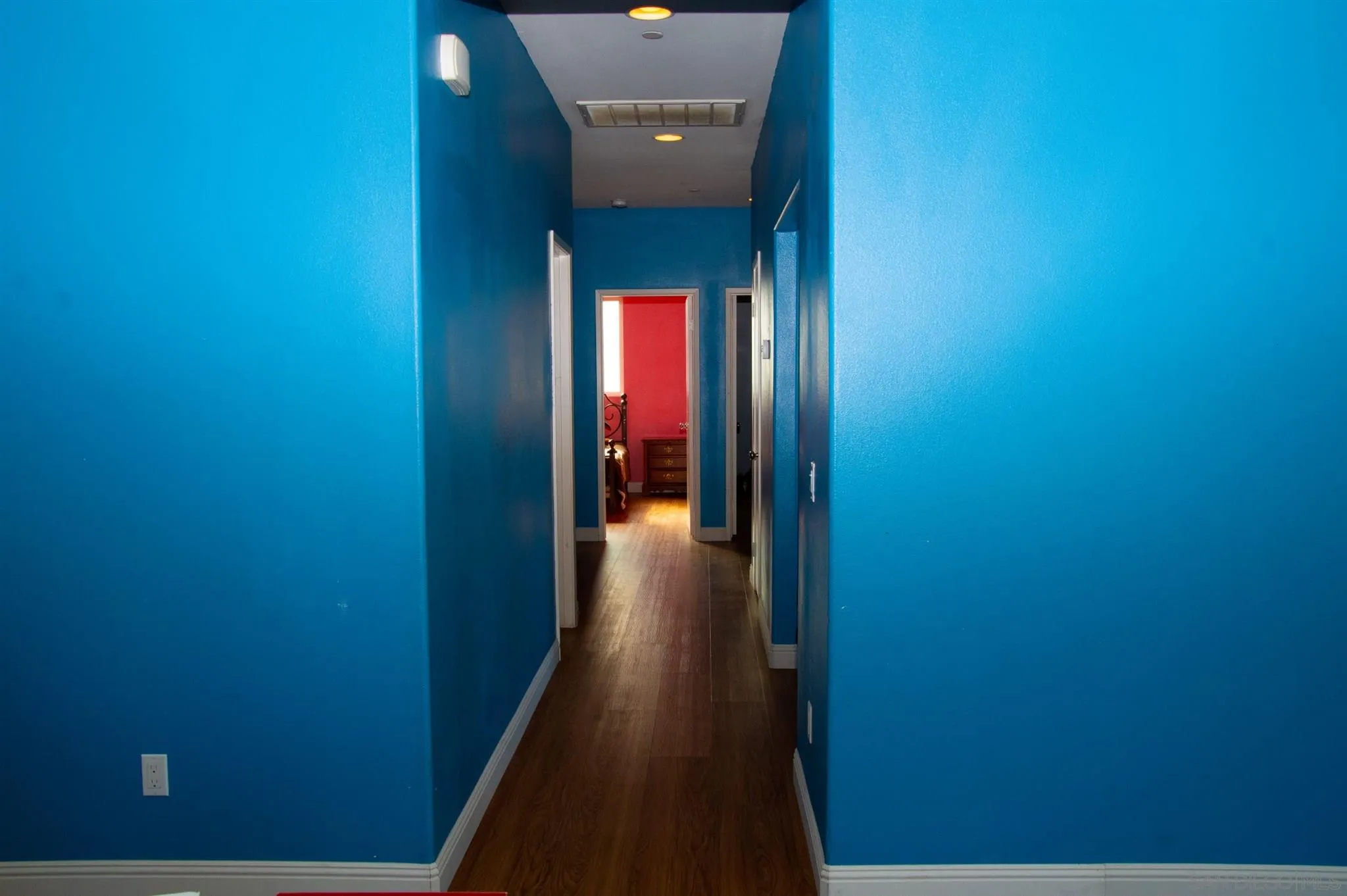 2131 Canvas Way San Jacinto, CA 92582 - Photo 14 of 36 a view of a hallway with wooden floor