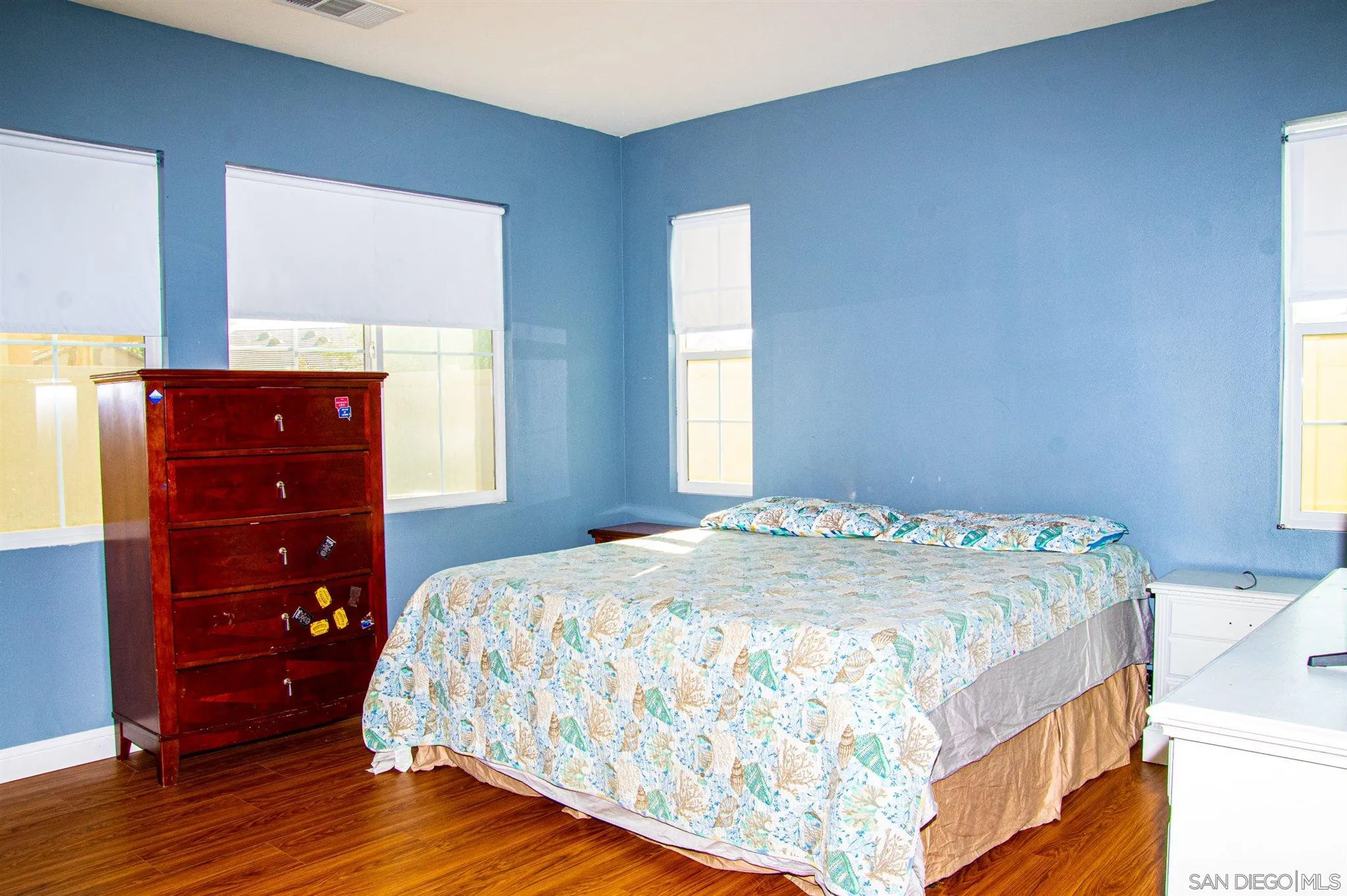 2131 Canvas Way San Jacinto, CA 92582 - Photo 16 of 36 a bedroom with a bed and a dresser