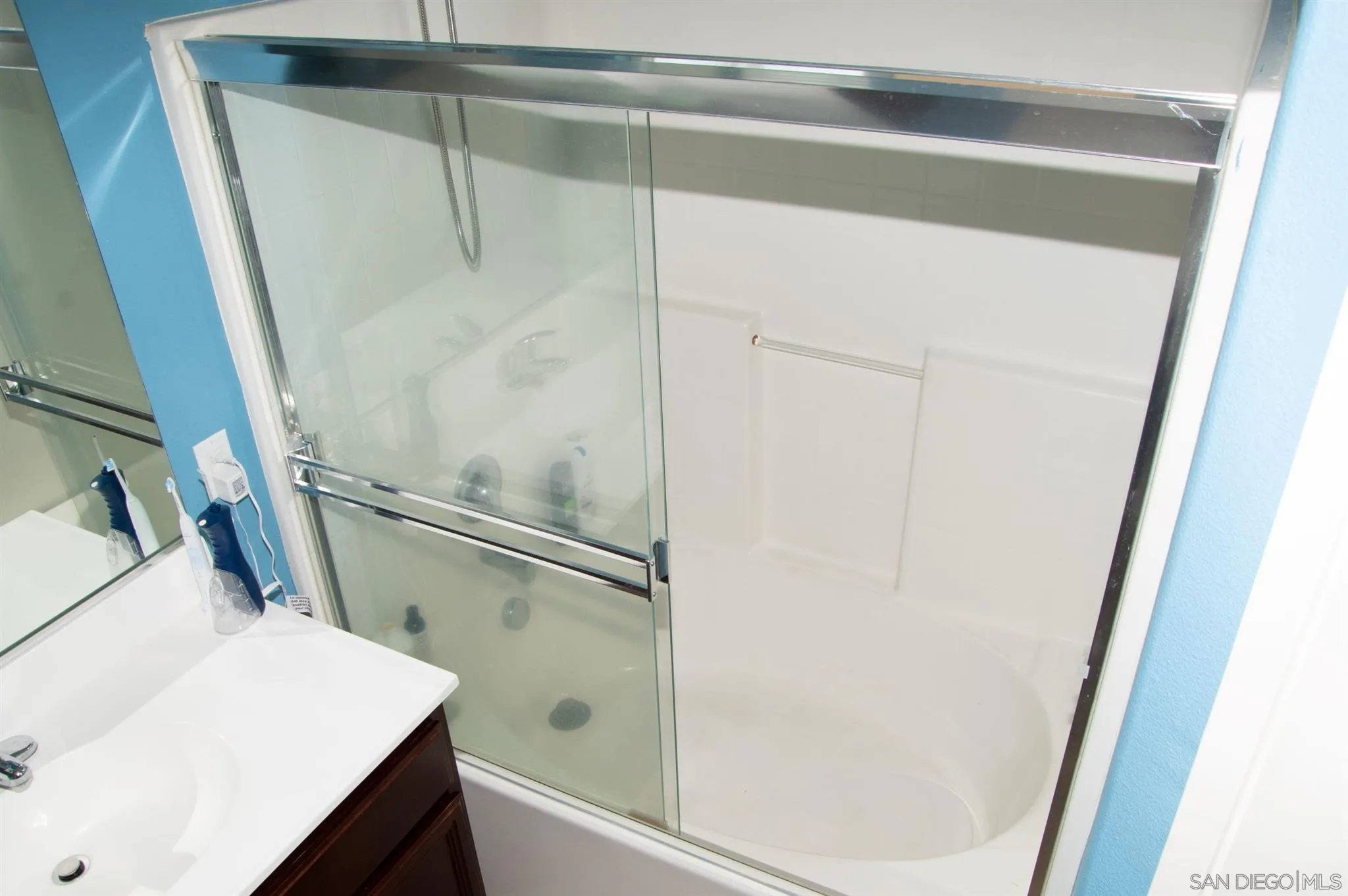 2131 Canvas Way San Jacinto, CA 92582 - Photo 21 of 36 a bathroom with a sink and a shower