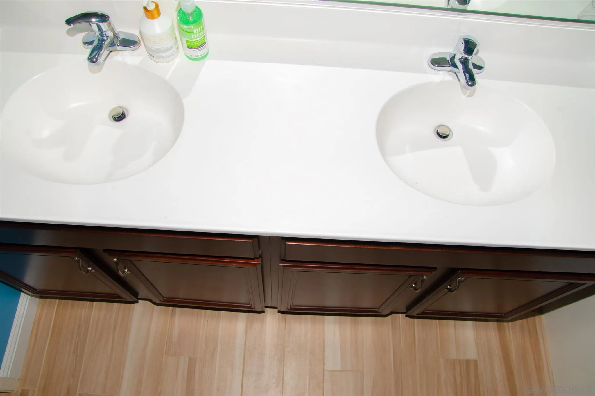 2131 Canvas Way San Jacinto, CA 92582 - Photo 22 of 36 a bathroom with a sink and a mirror