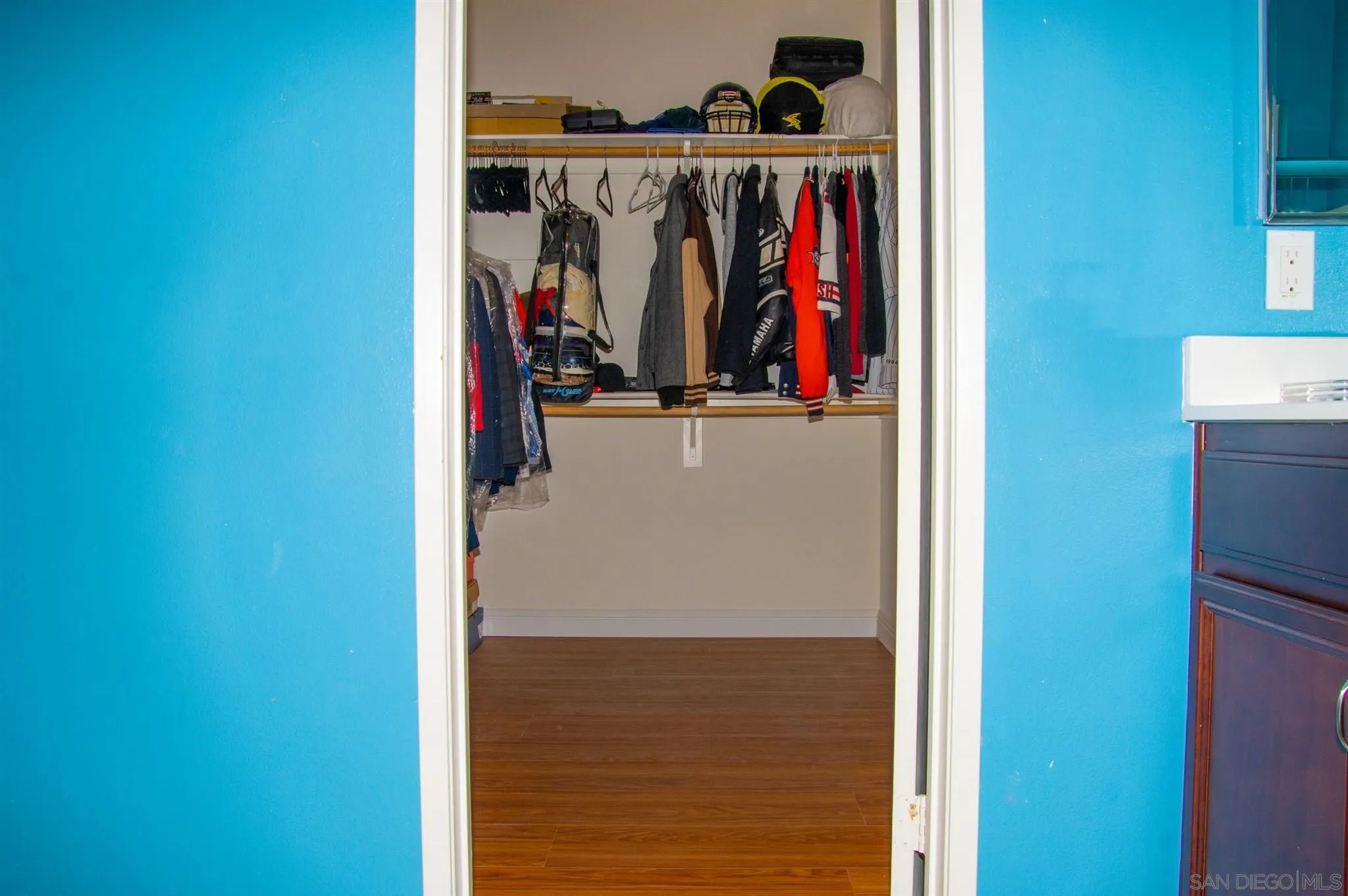 2131 Canvas Way San Jacinto, CA 92582 - Photo 23 of 36 a view of walk in closet with clothes