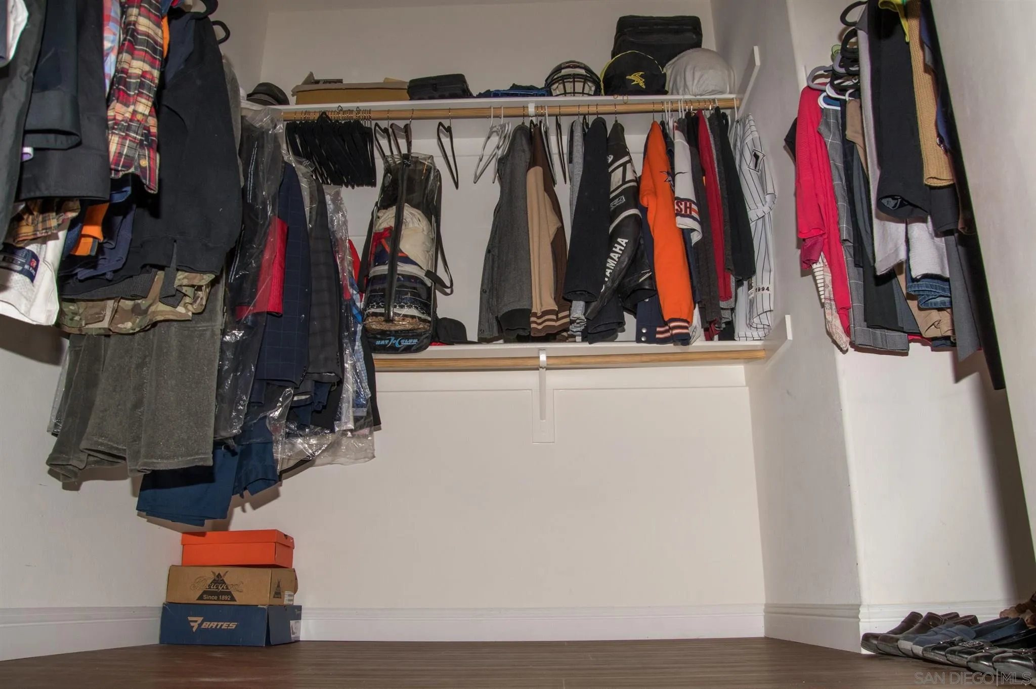 2131 Canvas Way San Jacinto, CA 92582 - Photo 24 of 36 a view of walk in closet with clothes and shoes