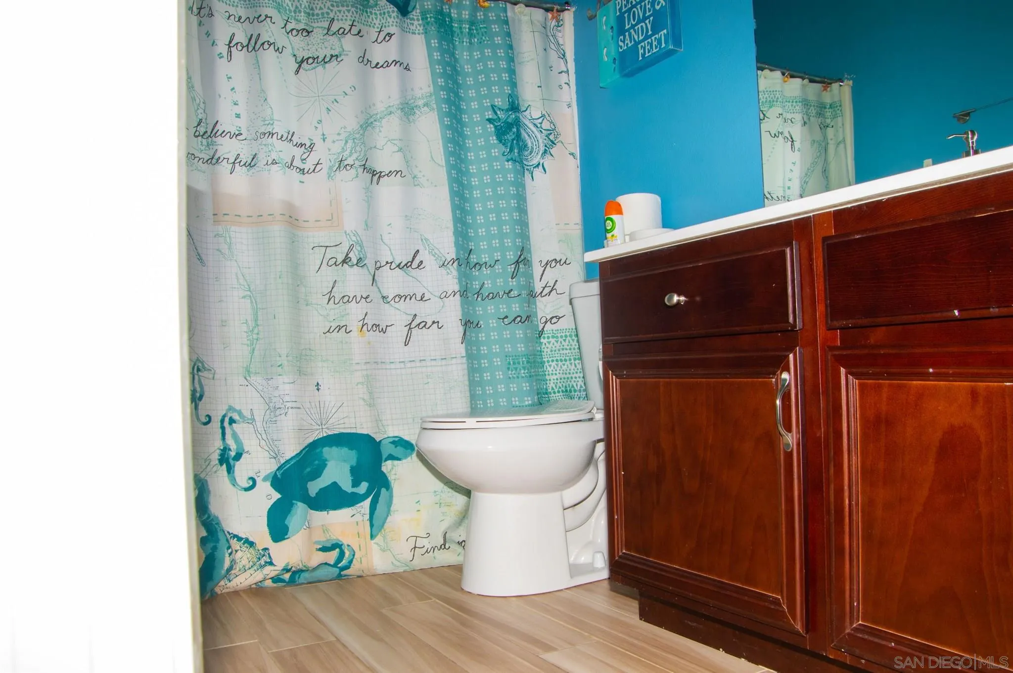 2131 Canvas Way San Jacinto, CA 92582 - Photo 29 of 36 a bathroom with a toilet and a shower