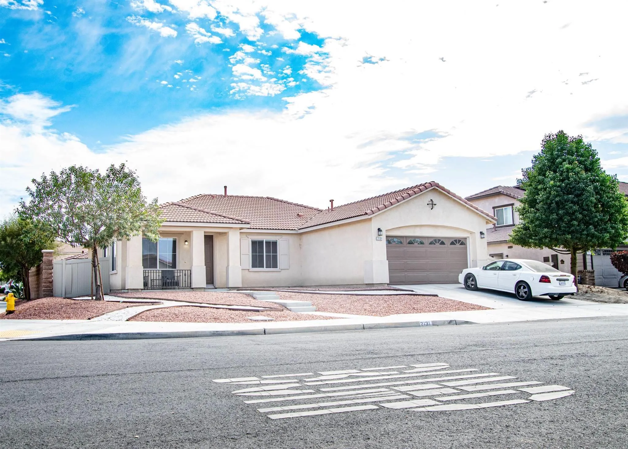 2131 Canvas Way San Jacinto, CA 92582 - Photo 3 of 36 a front view of a house with a yard