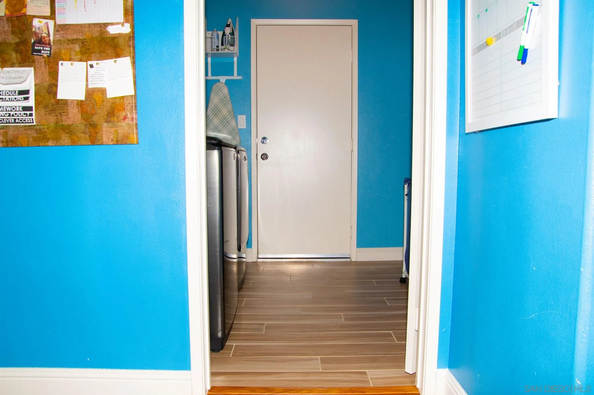 2131 Canvas Way San Jacinto, CA 92582 - Photo 35 of 36 a view of a hallway with wooden floor