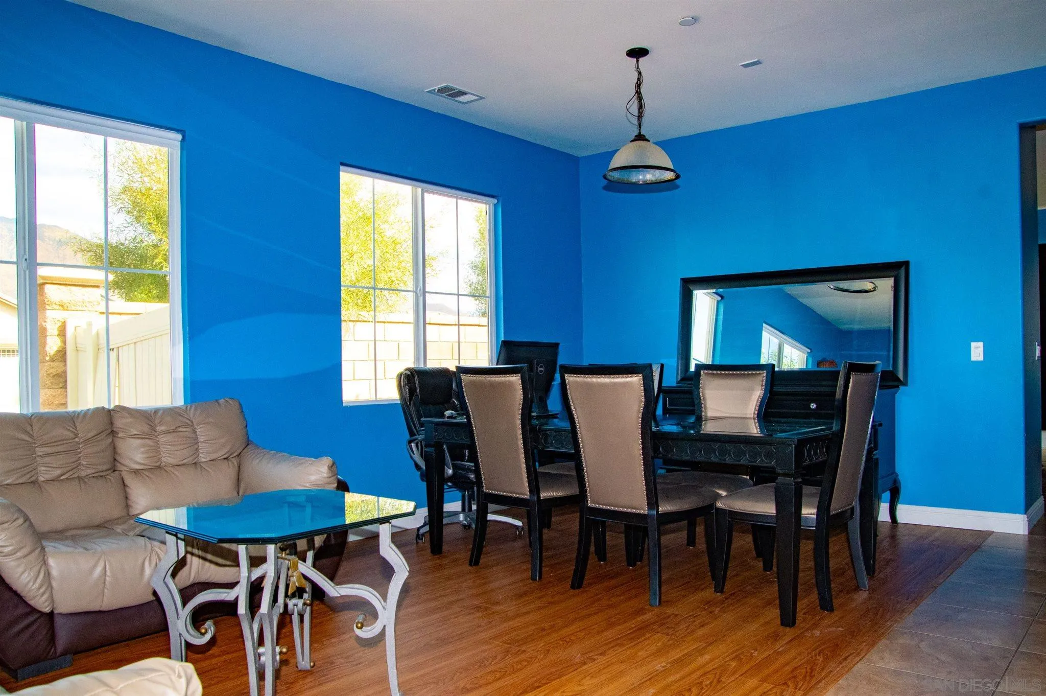 2131 Canvas Way San Jacinto, CA 92582 - Photo 6 of 36 a view of a dining room with furniture window and wooden floor