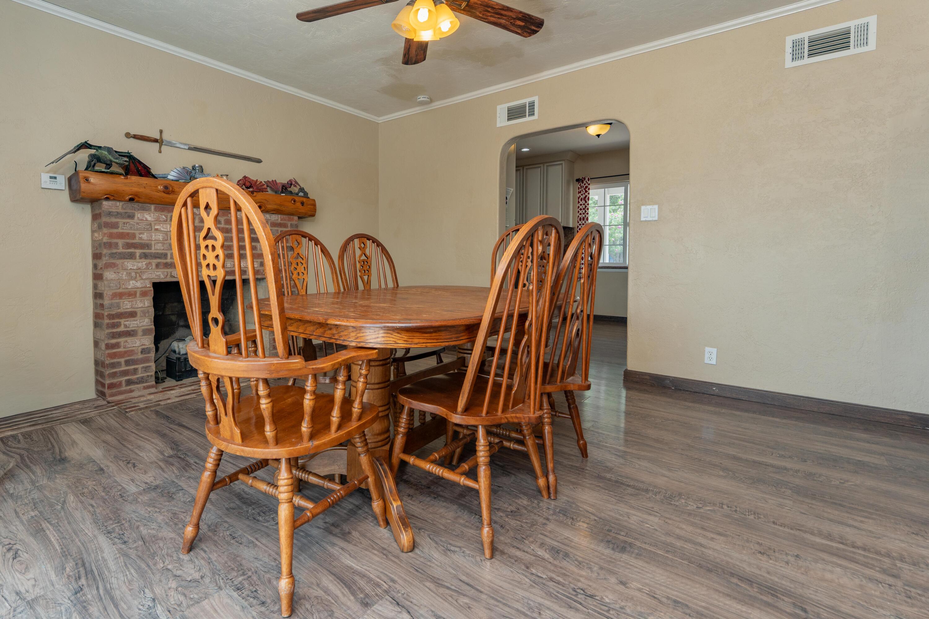 570 North Birch Avenue Reedley, CA 93654 - Photo 21 of 52 a view of a dining room with furniture and wooden floor