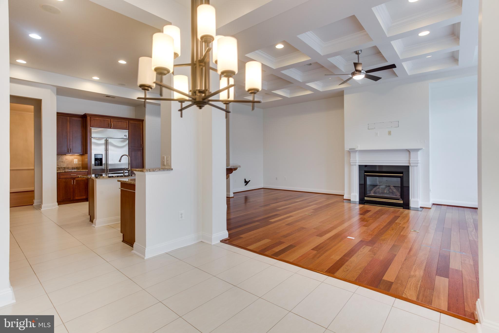 18353 Fairway Oaks Square Leesburg, VA 20176 - Photo 11 of 50 a view of a kitchen with refrigerator and wooden floor