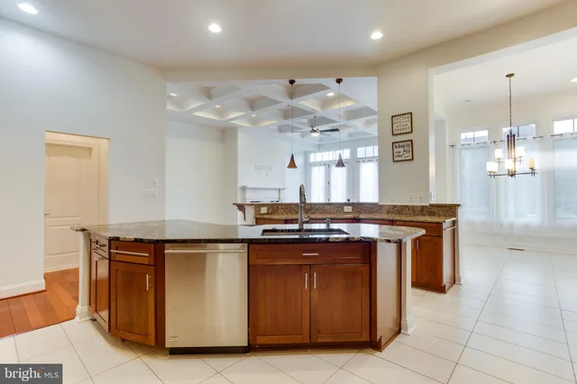 a kitchen with stainless steel appliances granite countertop a stove and a refrigerator