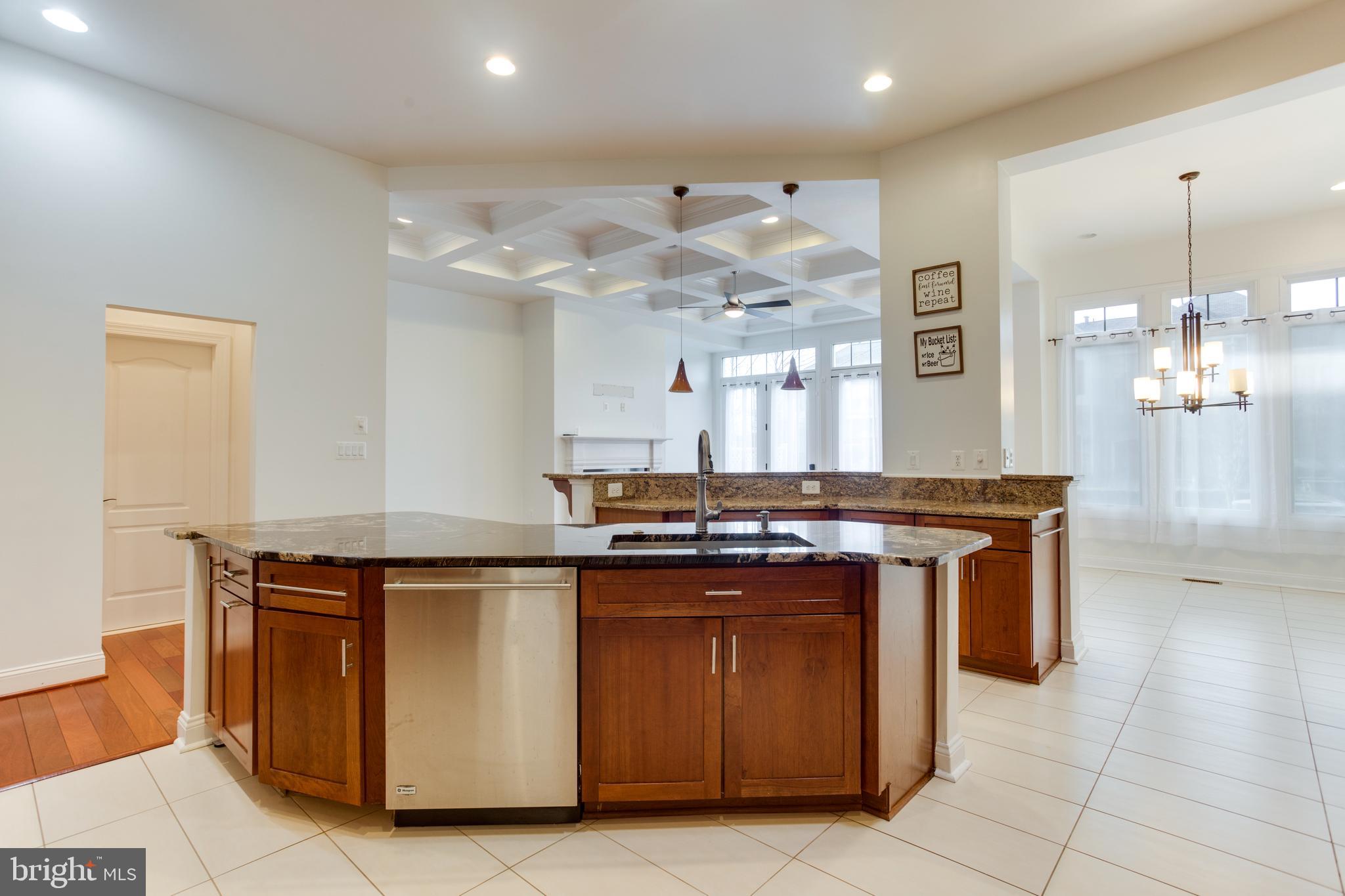 18353 Fairway Oaks Square Leesburg, VA 20176 - Photo 14 of 50 a kitchen with stainless steel appliances granite countertop a stove and a refrigerator