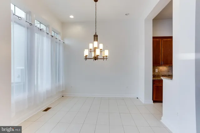 a view of a kitchen with a sink and a window