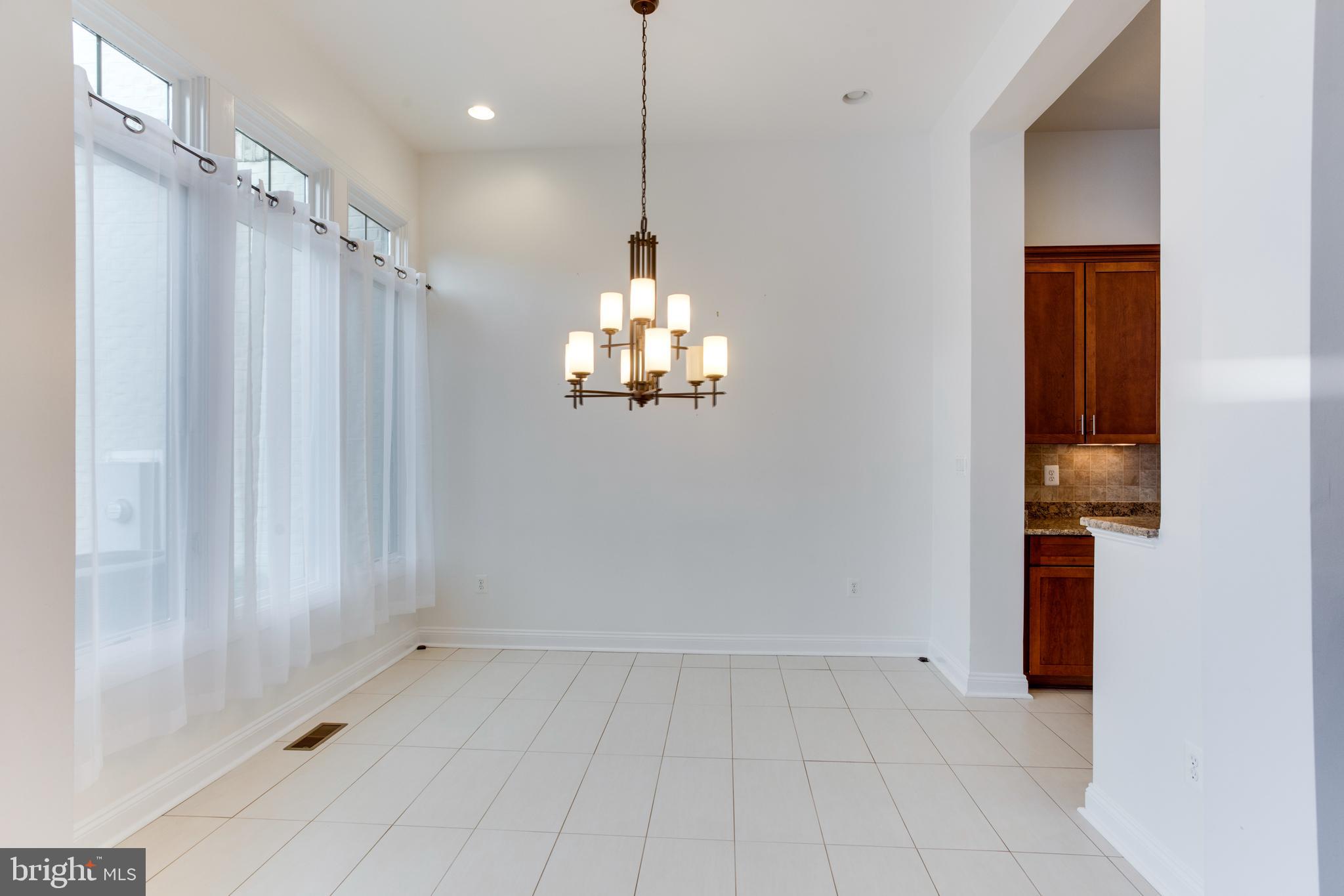 18353 Fairway Oaks Square Leesburg, VA 20176 - Photo 16 of 50 a view of a kitchen with a sink and a window