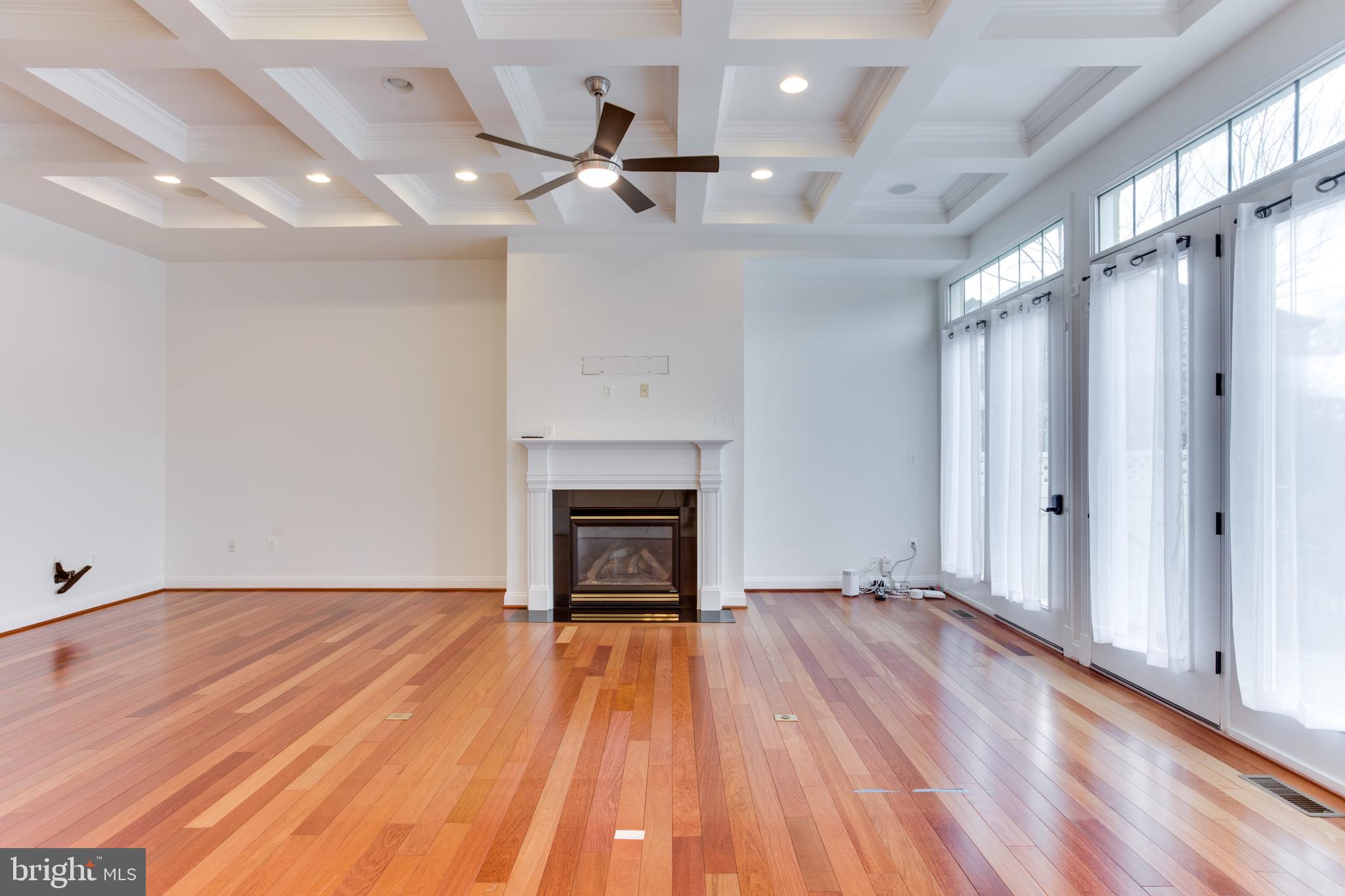 18353 Fairway Oaks Square Leesburg, VA 20176 - Photo 18 of 50 a view of empty room with wooden floor and fireplace