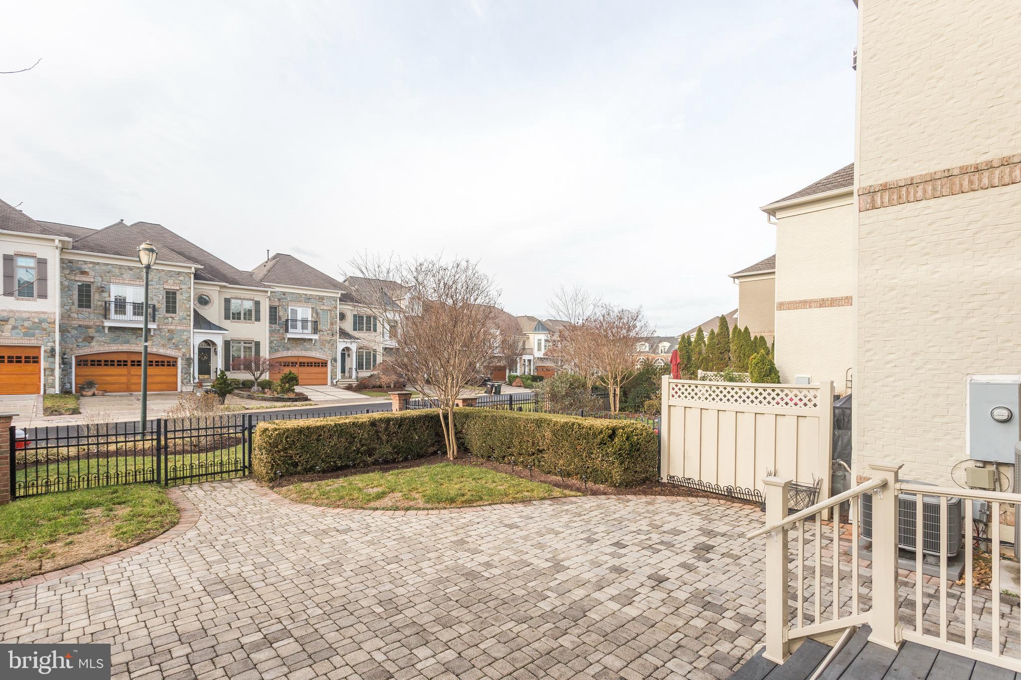 18353 Fairway Oaks Square Leesburg, VA 20176 - Photo 20 of 50 a view of a terrace with a bench