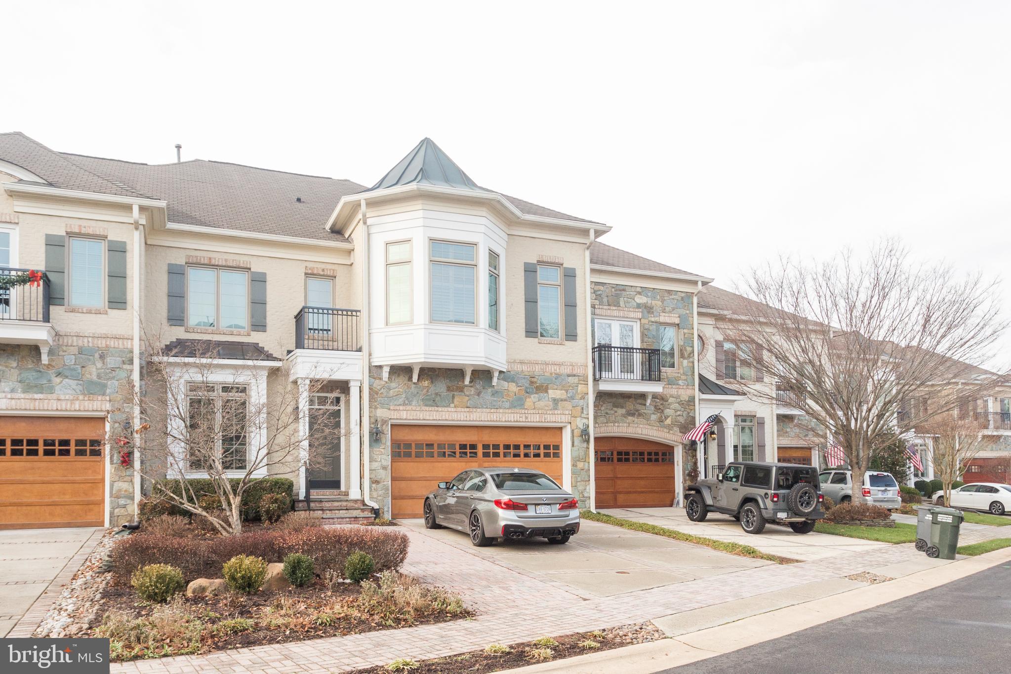 18353 Fairway Oaks Square Leesburg, VA 20176 - Photo 2 of 50 a car parked in front of a building