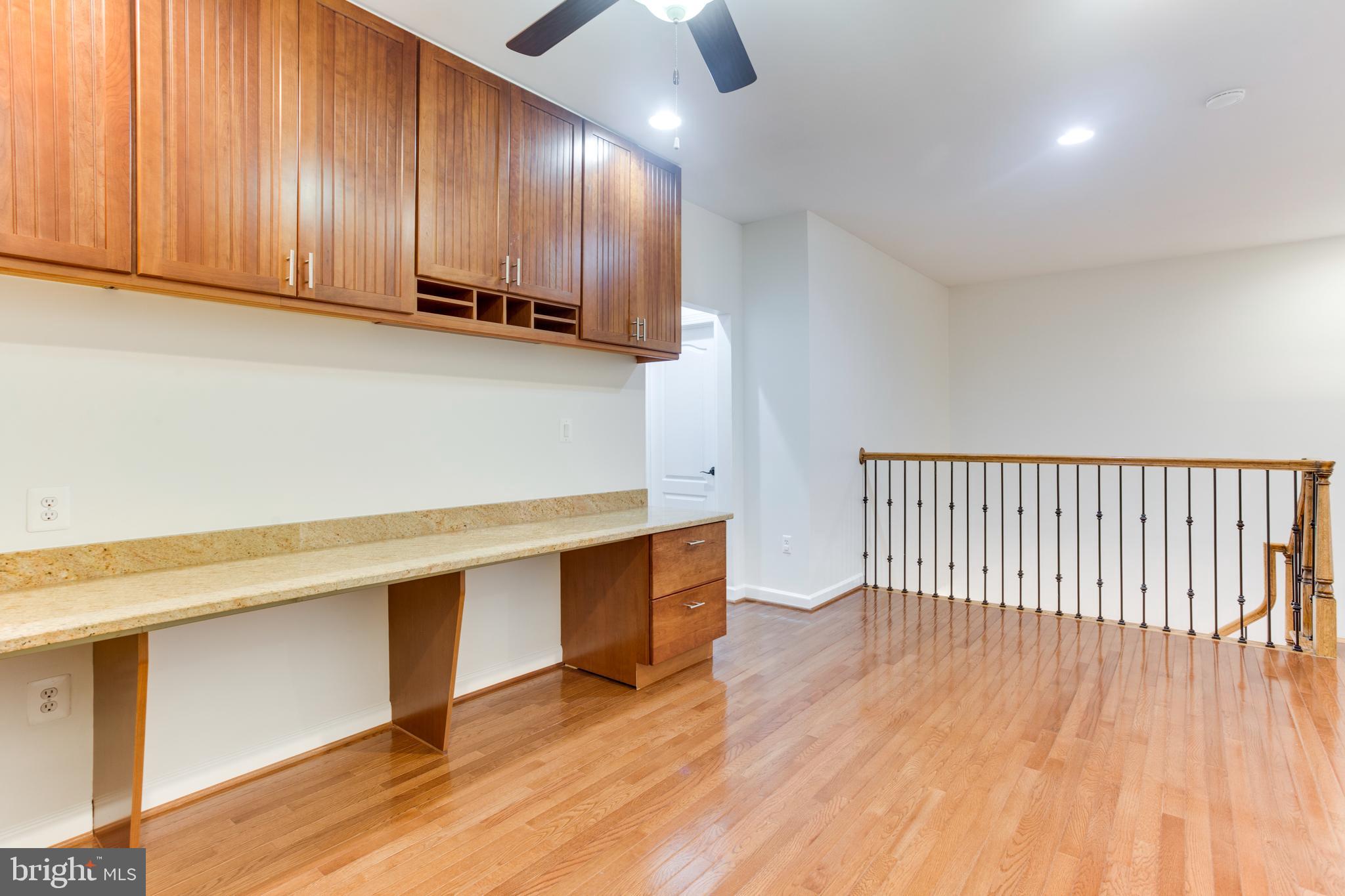 18353 Fairway Oaks Square Leesburg, VA 20176 - Photo 27 of 50 a view of a kitchen with wooden floor and cabinets