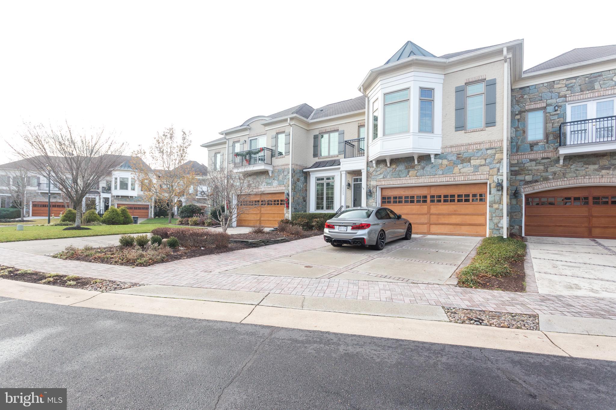 18353 Fairway Oaks Square Leesburg, VA 20176 - Photo 3 of 50 a car parked on the side of the road