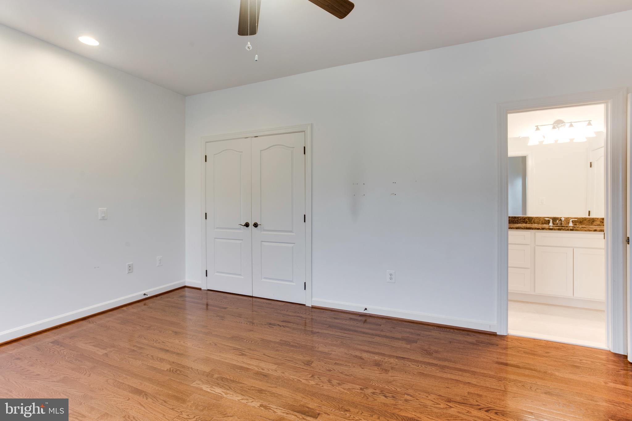 18353 Fairway Oaks Square Leesburg, VA 20176 - Photo 31 of 50 a view of an empty room with wooden floor
