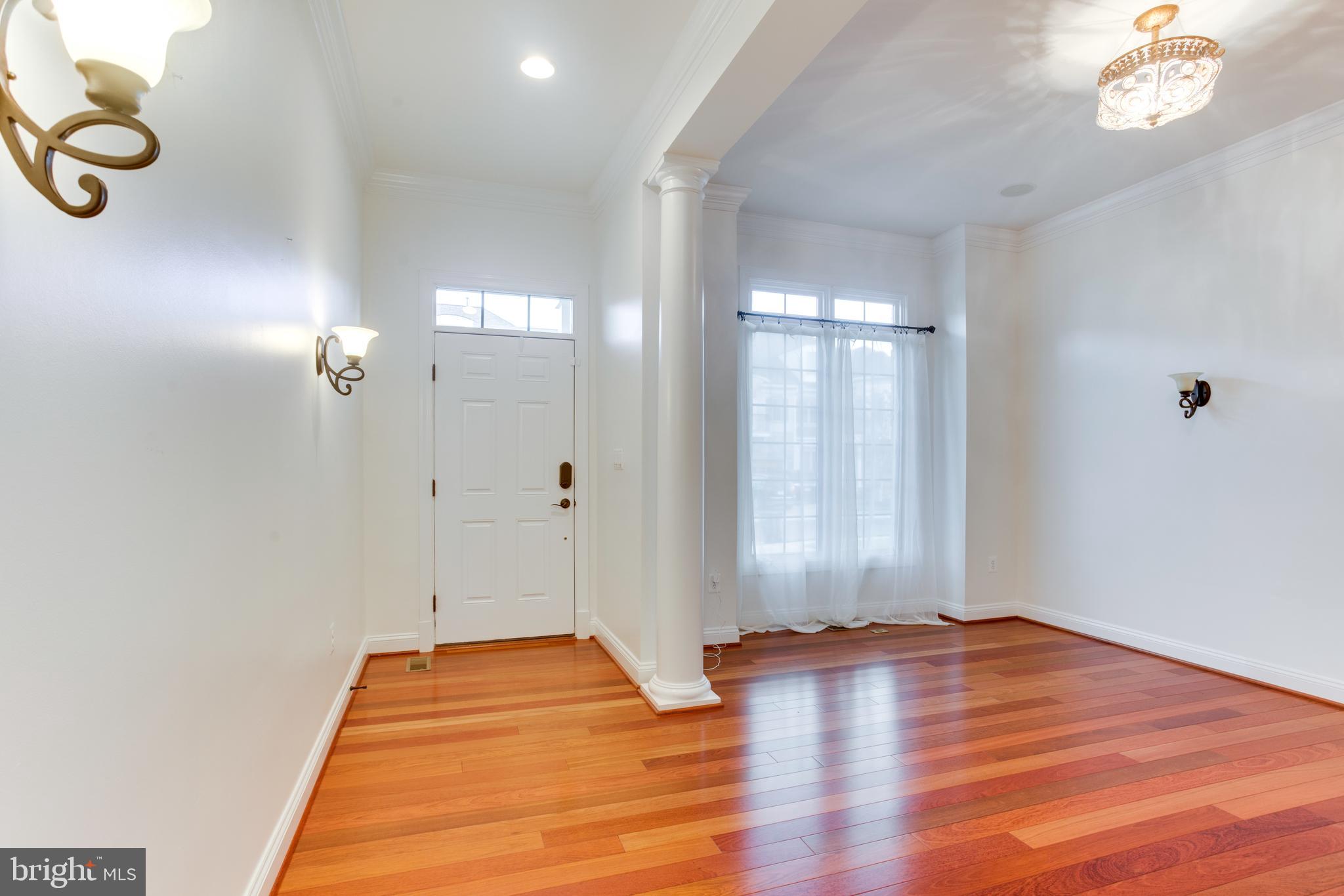 18353 Fairway Oaks Square Leesburg, VA 20176 - Photo 4 of 50 a view of a room with wooden floor and fan
