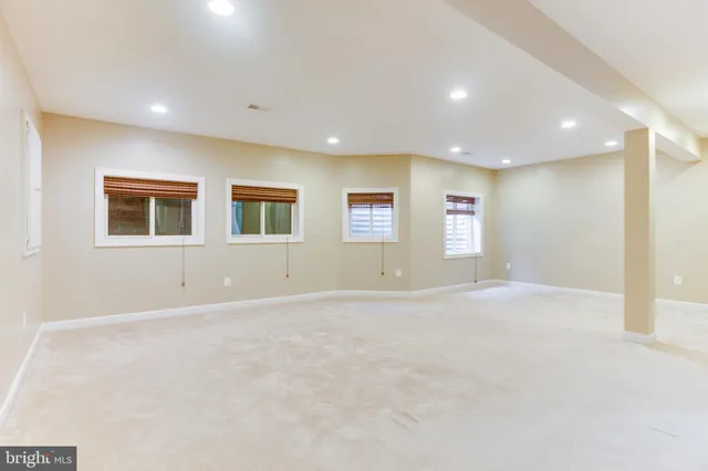 a view of an empty room with windows