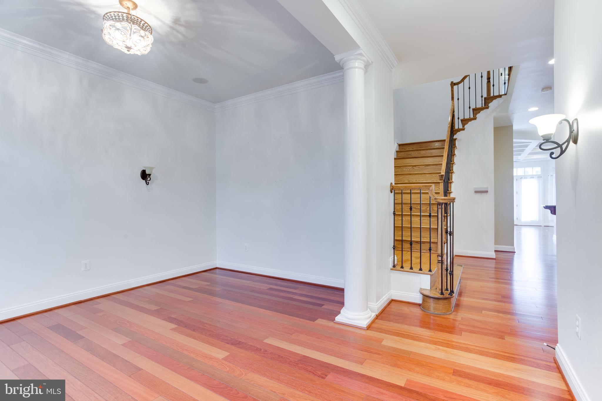 18353 Fairway Oaks Square Leesburg, VA 20176 - Photo 6 of 50 a view of empty room with wooden floor and fan