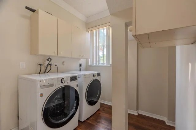 a view of livingroom with washer and dryer
