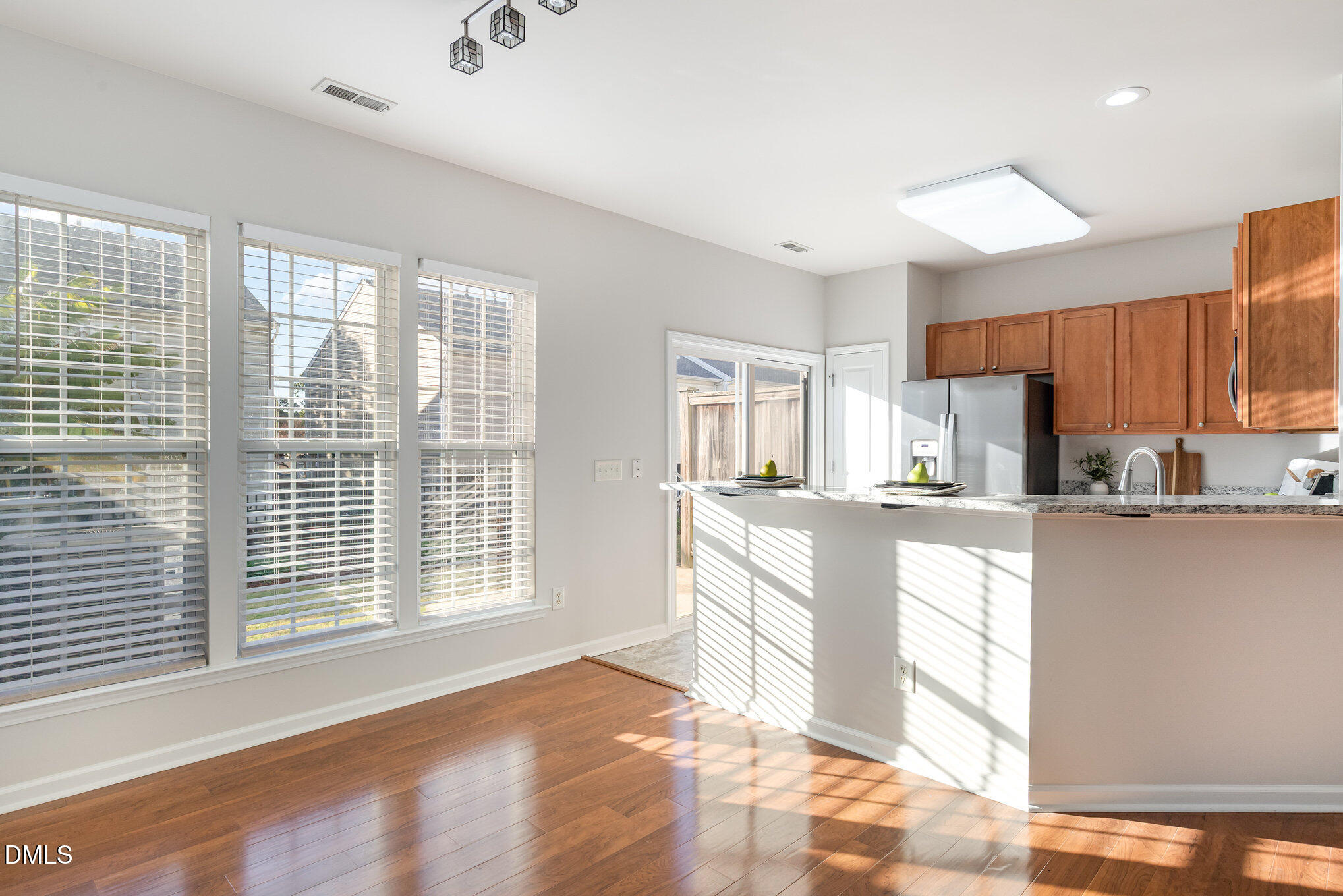 8325 Pilots View Drive Raleigh, NC 27617 - Photo 11 of 28 a kitchen with stainless steel appliances granite countertop a stove a sink and a refrigerator