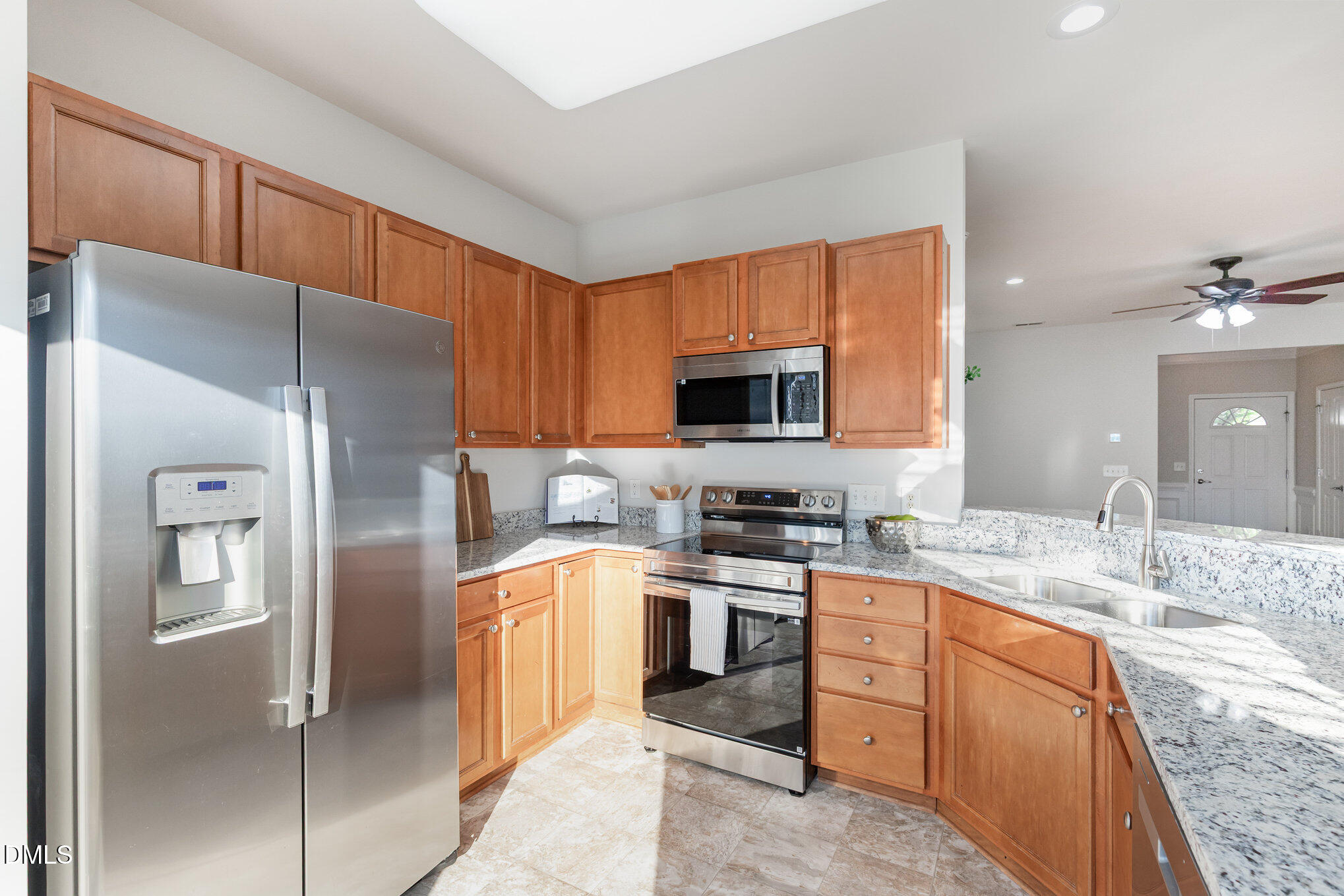 8325 Pilots View Drive Raleigh, NC 27617 - Photo 15 of 28 a kitchen with stainless steel appliances granite countertop a refrigerator stove and sink