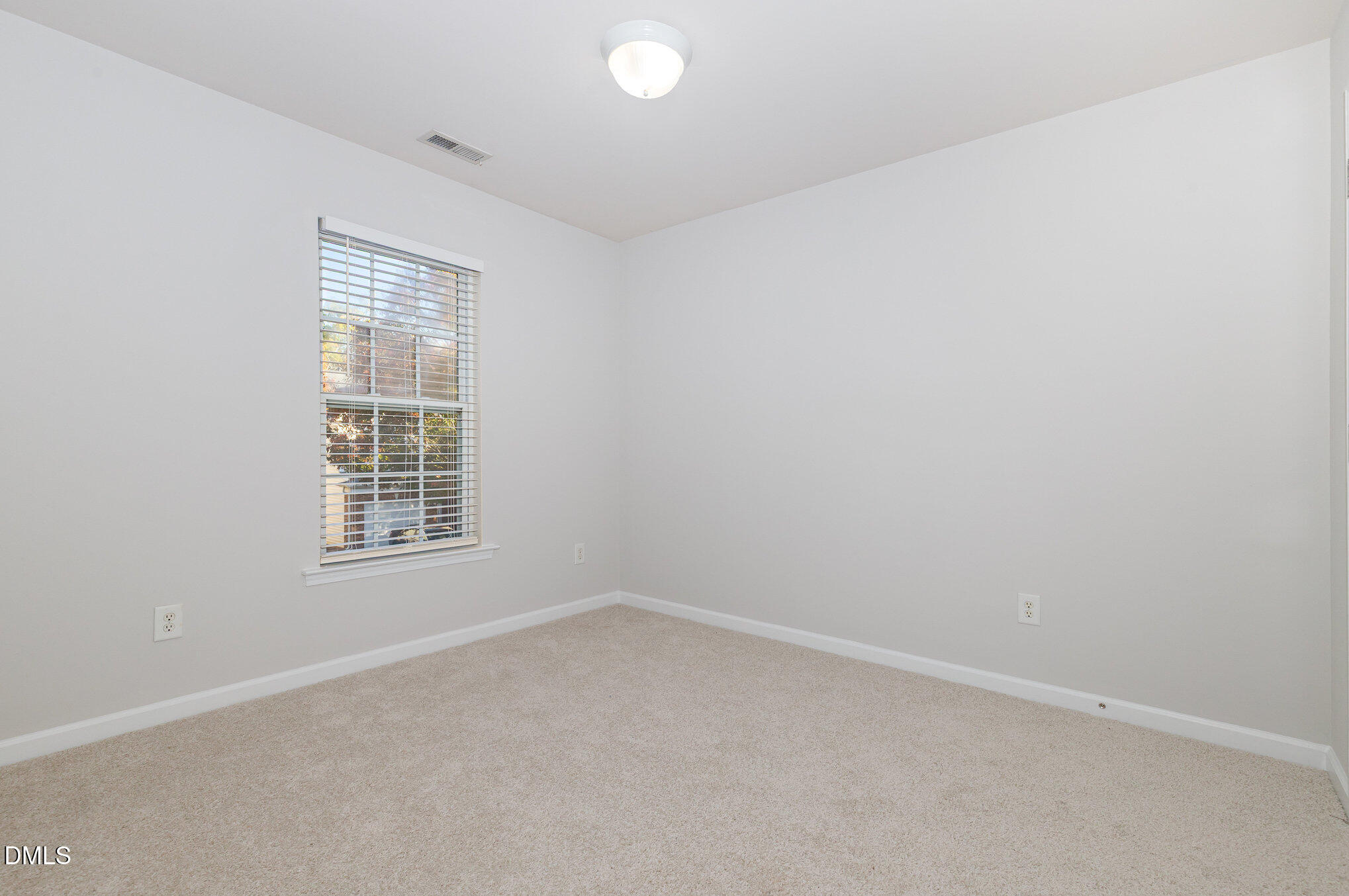 8325 Pilots View Drive Raleigh, NC 27617 - Photo 22 of 28 an empty room with a window